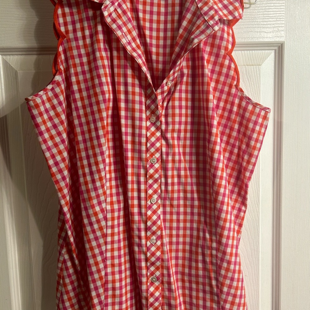 Sleeveless red and white gingham top.